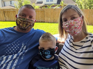 Former Y-12 employee Sheila Gideon and her family wear masks made by Jennifer Lawson and her sister.