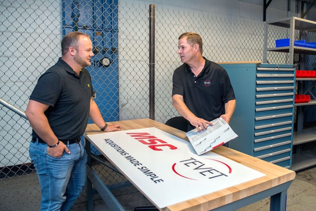  Y-12 Procurement Coordinator Derek Raby, left, and Dennis Lorick of onsite vendor Tevet discuss some of the items that will be available at the new tool crib and parts station.