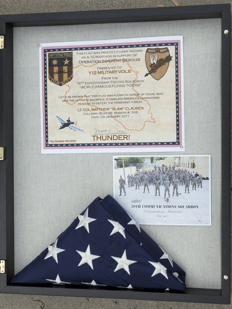 The certificate, photograph and flag are displayed in the group’s area in Jack Case Center. 