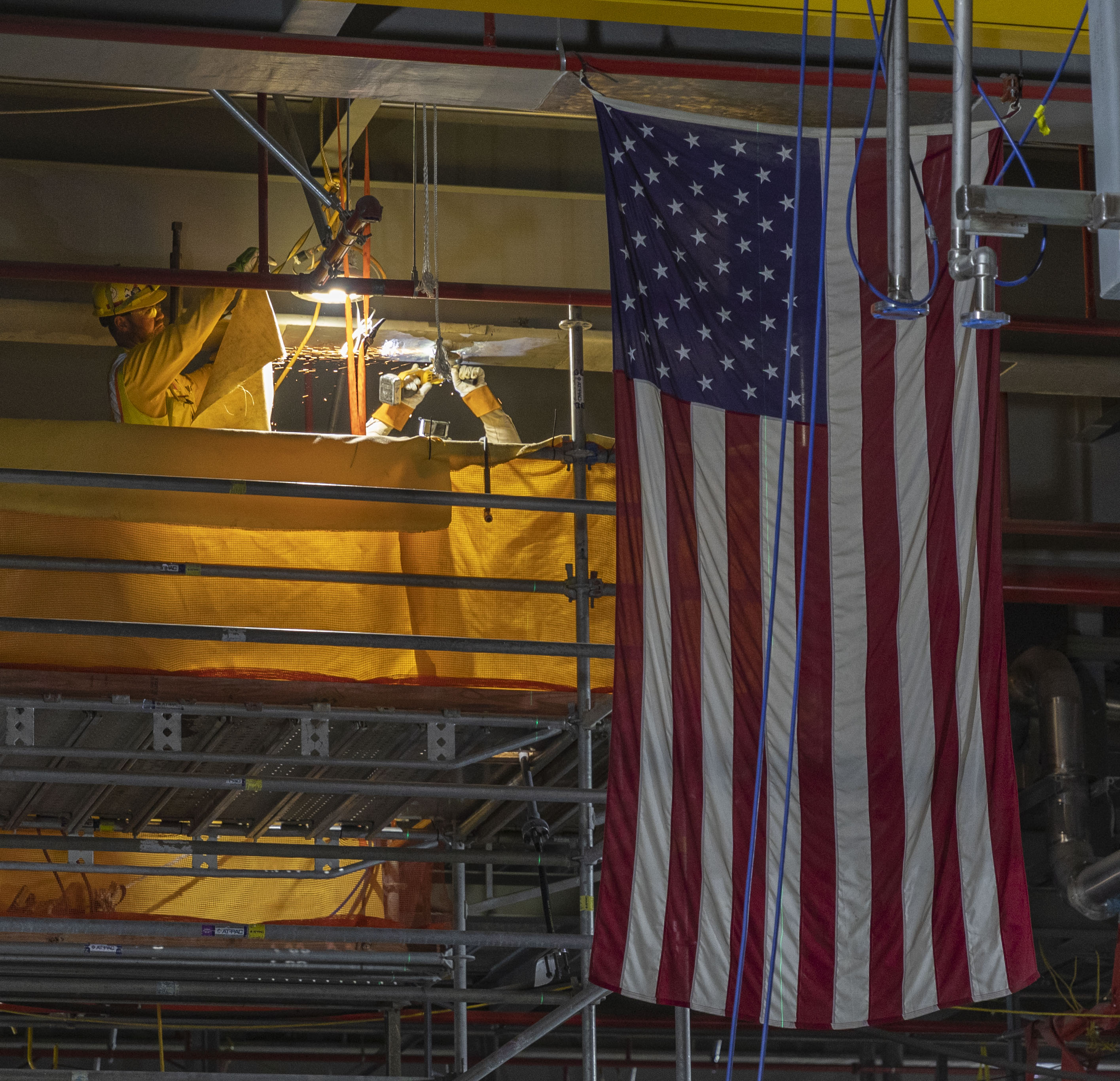 Ironworkers prep structural steel for pipe supports installation in the Main Process Building Main Casting Area 