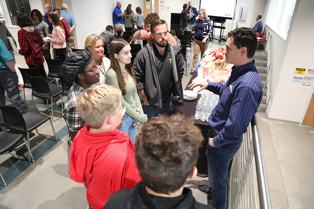 Students from Robertsville Middle School get a jump on their project to the representative from Clayton Homes of Appalachia. 