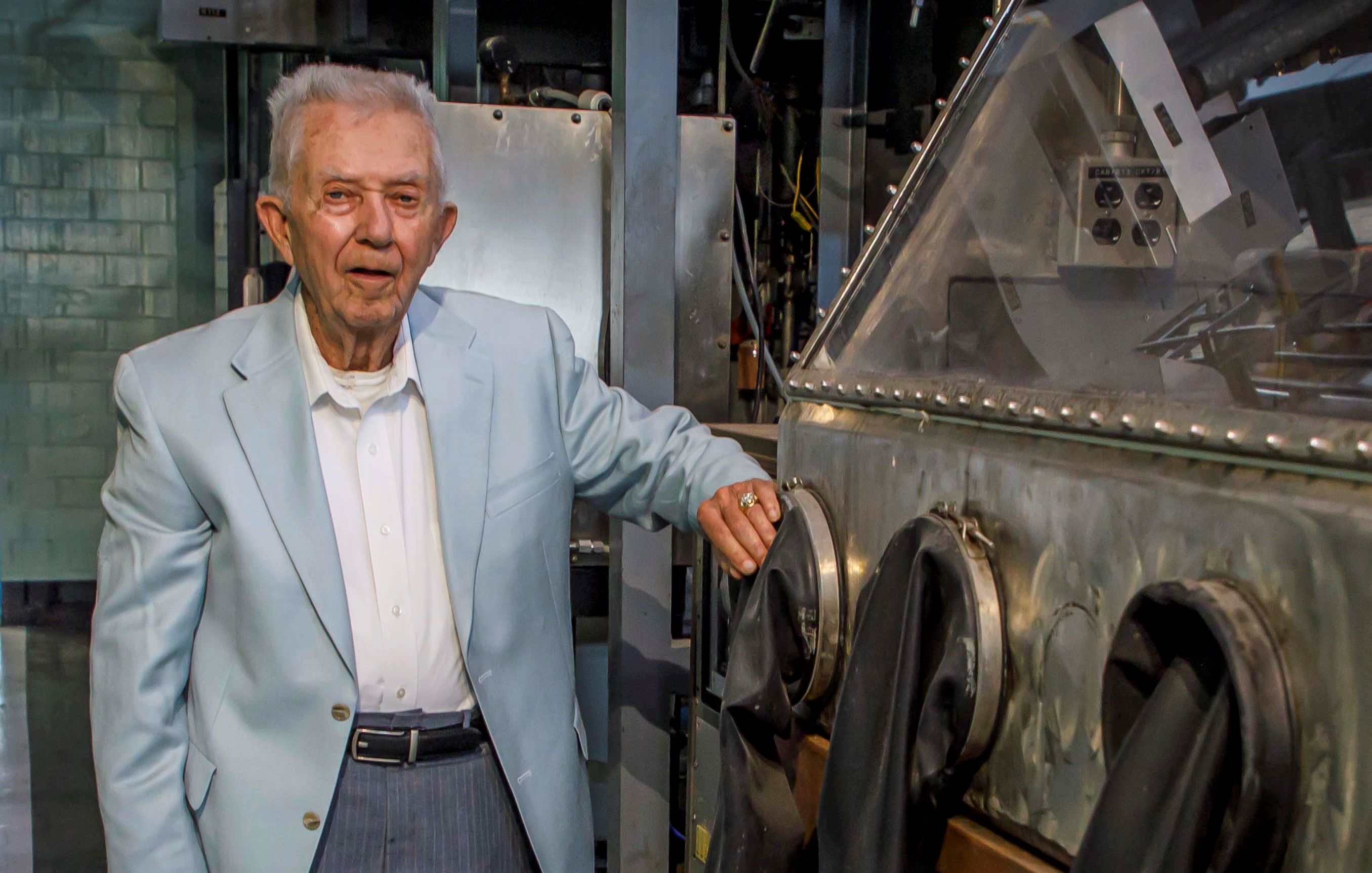 Bill Clark poses next to a glove box similar to one he worked with in the 1950’s