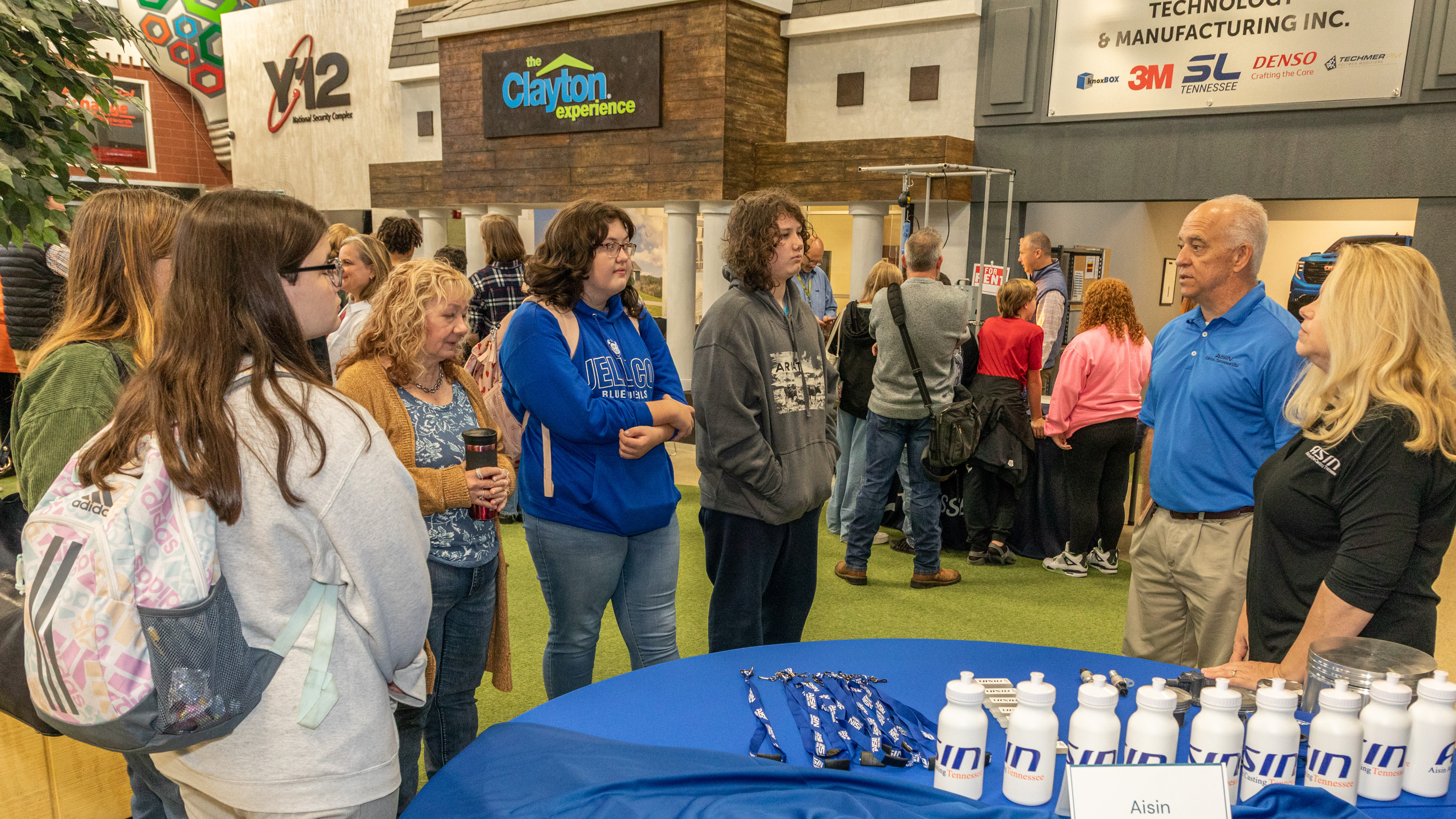 LaFollette Middle School students interact with representatives from Aisin Automotive Casting Tennessee