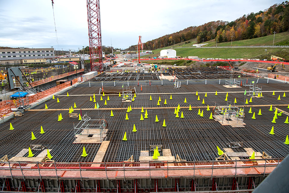 Cones protect the electrical grounding system of the Salvage and Accountability Building (SAB) until concrete is placed for the foundation. SAB will contain waste preparation, decontamination, non-destructive assay and chemical recovery support systems.