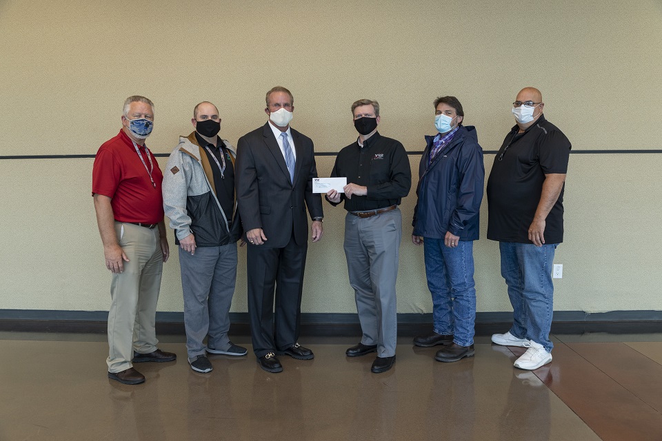 ETF President and CEO Michael McClamroch (third from left) receives a $500 donation through Y-12’s Safety Challenge