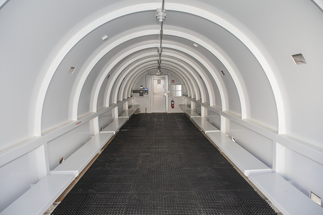 The shelter has perimeter benches that provide employees a place to sit. Rubber matting is also on the floor, providing a layer of cushion.  