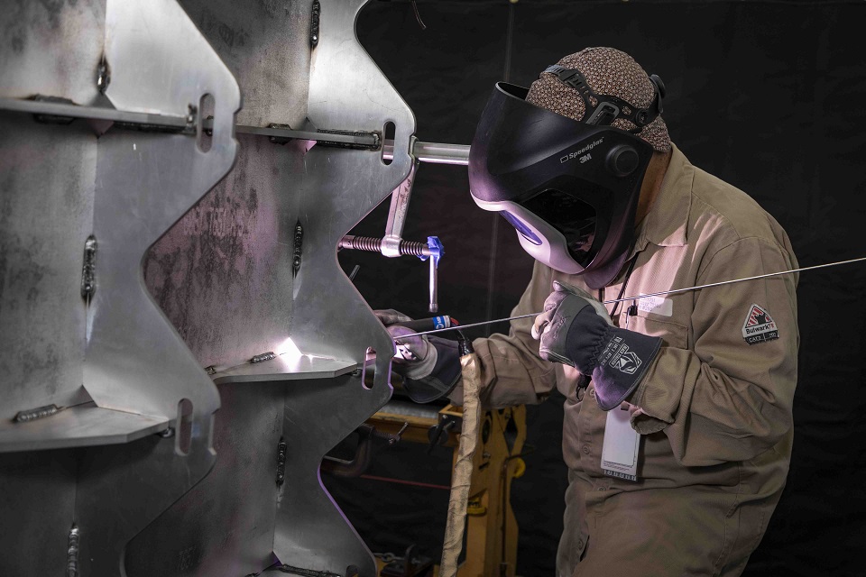 Welder Joel Chavez welds a tooling fixture