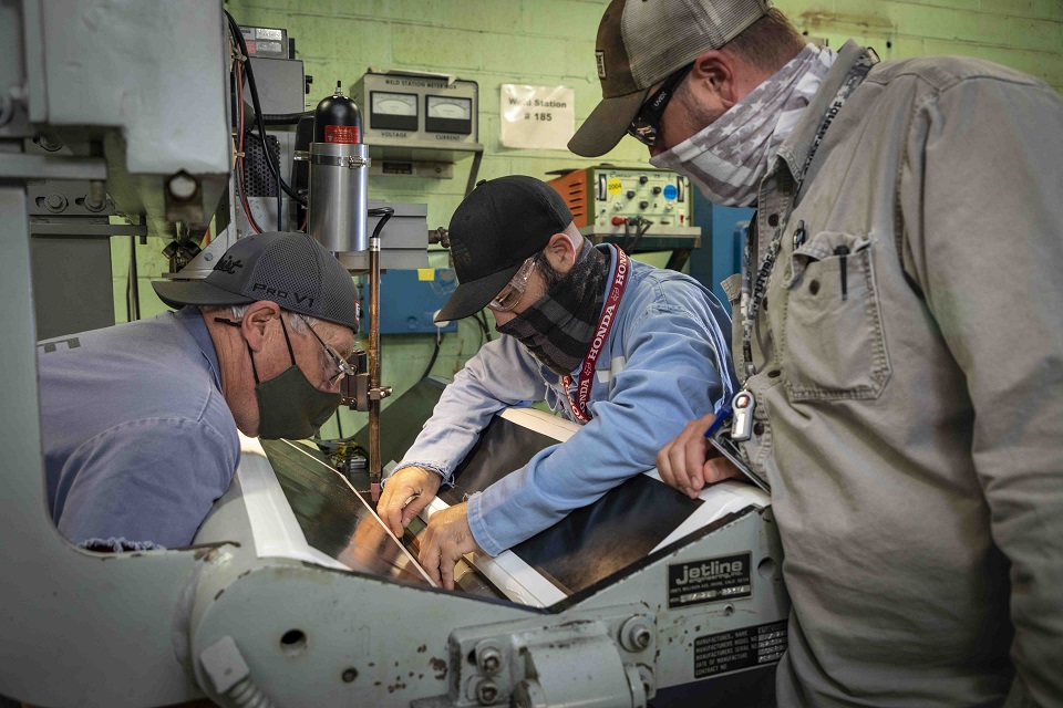 From left, sheet metal worker Rick Valentine, welder Levi McDaniel, and machining supervisor Mike Woosley 