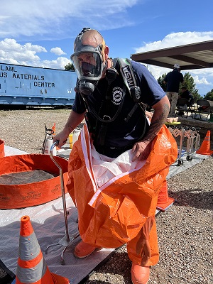 Y-12 Fire Department’s Jeff Foster stops at a mock decontamination station after completion of an exercise.