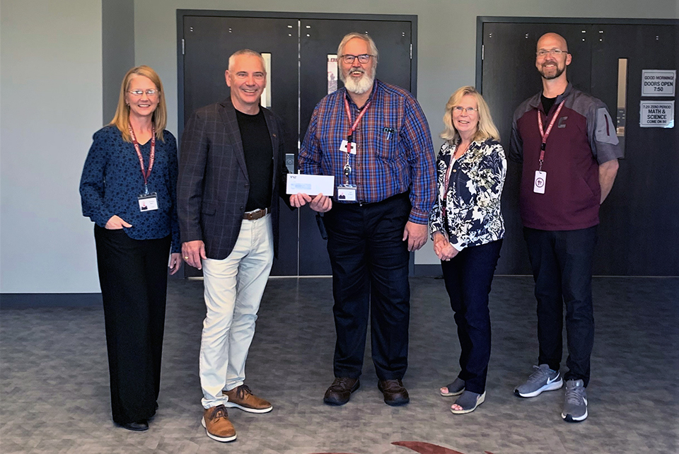 Y-12 Site Manager Gene Sievers (second from left) presents a $5,000 STEM grant to Concord Christian School to develop a self-sustaining tabletop aquaponics system with 10th through 12th graders. 