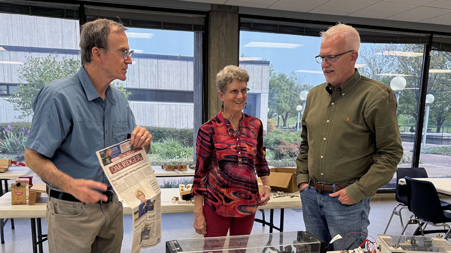 Roane State Nuclear Technology Program Director Joe Stainback, Ph.D. (right), watches as Y-12 computer programmer Ken L. and AMSE education outreach specialist Kris L. demonstrate activities from their new Atoms and Energy class.