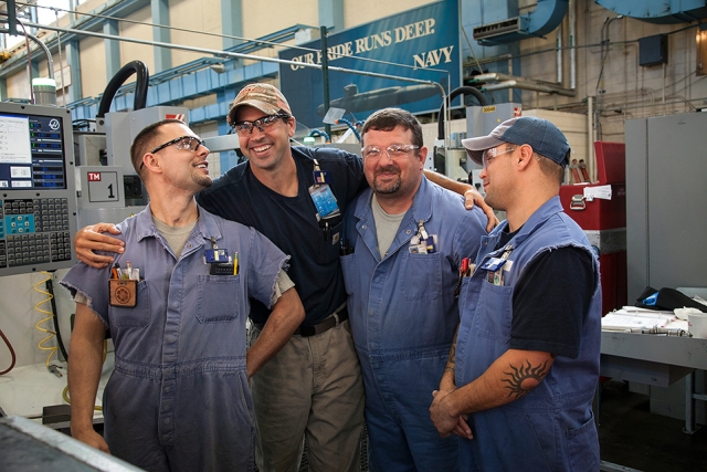 From left: Apprentice machinists John Bryant, Justin Dupas, Brice Graham and Jeff Bryant share a laugh and camaraderie on the shop floor.