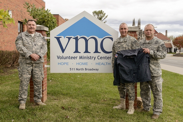 Veterans and current Y‑12 Security Police Officers delivered former uniform coats to the Volunteer Ministry Center.