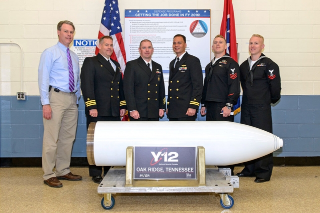 Director of Assembly/Disassembly Operations Abe Mathews (left) gives the USS Tennessee sailors a behind the scenes look at Y–12.