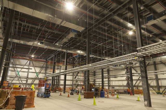 Cable tray supports, cable tray, and heating, ventilation, and air conditioning equipment is installed on the Uranium Processing Facility Mechanical Electrical Building second floor.