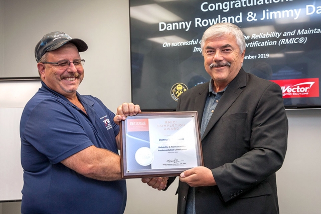 Y-12’s Danny Rowland, left, receives his Reliability and Maintainability Implementation Certification from UT’s Dr. Klaus Blache. “Once you understand how reliability and maintainability best practices impact operational efficiency and effectiveness, it’s much easier to focus work on what really matters,” Blache said.