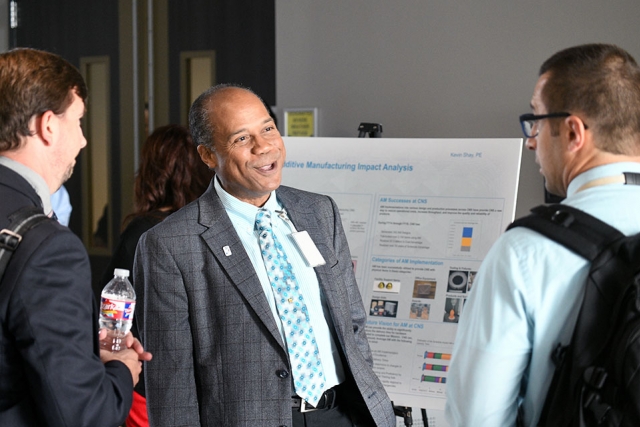 Fellow Alan Moore talks to attendees at the 2nd Annual CNS Fellows Colloquium.