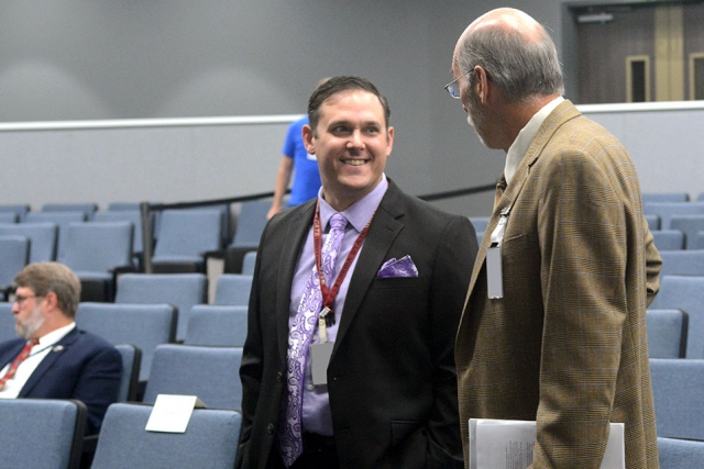 Ashley Stowe (left) talks to an attendee at the 2nd Annual CNS Fellows Colloquium.