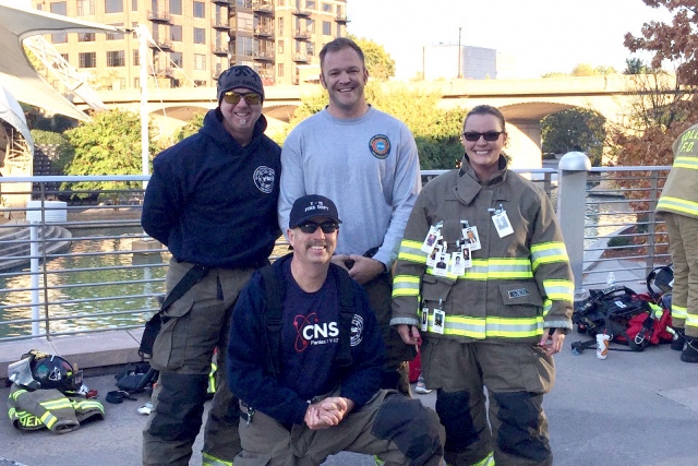 Y-12 firefighters (from left) Tom Bratcher, Ben Norton, April Allen and Fire Chief Scott Vowell (kneeling) participate in the 2016 National Fallen Firefighters Foundation Memorial Stair Climb at the Knoxville Sunsphere.