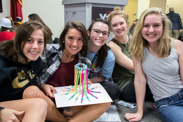 Future engineers from Oak Ridge High School display their STEM challenge creation. 