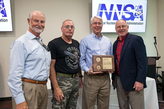 Jim McConnell, National Nuclear Security Administration’s Associate Administrator for Safety, Infrastructure and Operations (far right), presents an NA-50 Award of Excellence for Alpha-5 Annex Encapsulation. 