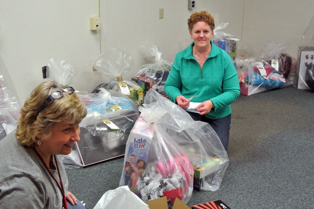 CNS employees at the Y-12 National Security Complex bundle toys and clothing for about 250 “adopted angels” through the site’s Angel Tree program.