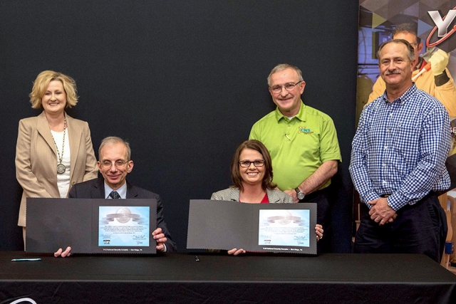 Consolidated Nuclear Security, LLC President and CEO Morgan Smith recently signed a mentor-protégé agreement with Cindy Hatfield. CEO of Hatfield Construction. From left, Small Business Program Manager Lisa Copeland and mentors Bill Hevrdeys and Ken Thompson were also present.