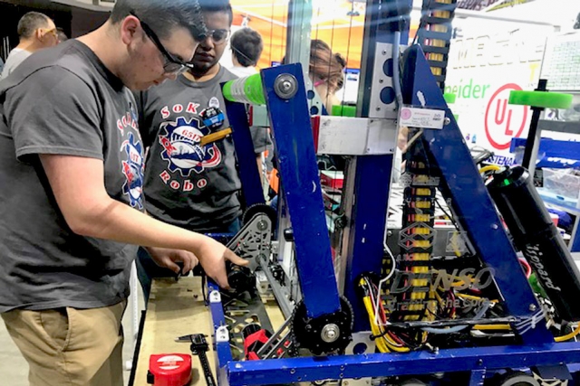 Students from South Doyle High School compete at the TN FIRST Smoky Mountains Regional robotics competition at Thompson Bowling Arena. CNS was a corporate sponsor, providing funds, volunteers, and mentors for the program.