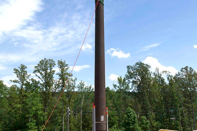 An electrical pole is installed as part of the Substation Subproject that will support the Uranium Processing Facility.  