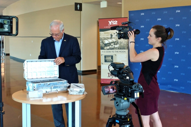 Paul Wasilko shows Emily DeVoe of WBIR one of the moon boxes built at Y-12 for the Apollo missions. 