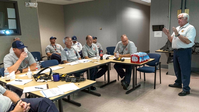 Bill Ho-Gland, Pantex assistant fire chief, discusses leadership and expectations with fire officers at Y-12 during a recent visit.