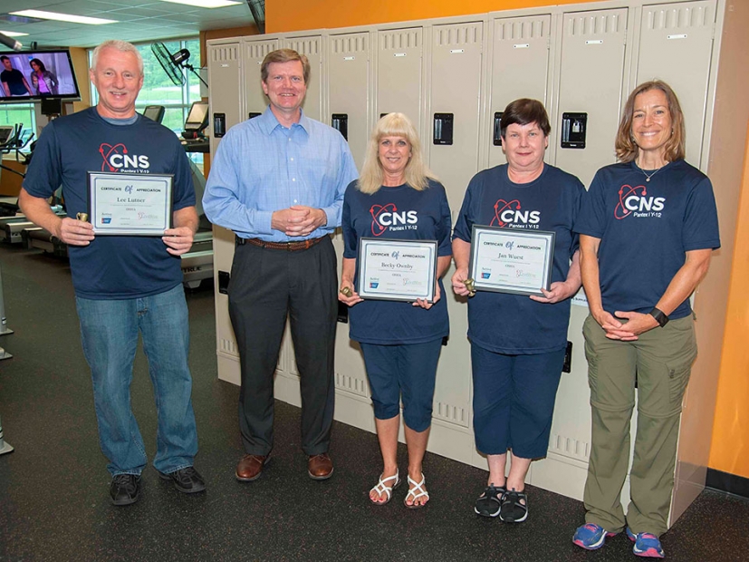 Y-12 Site Manager Bill Tindal (second left) and Karen Lacy (right), CNS wellness coordinator and Active for Life program co-director, congratulate members of CNS’s winning Active for Life challenge team.