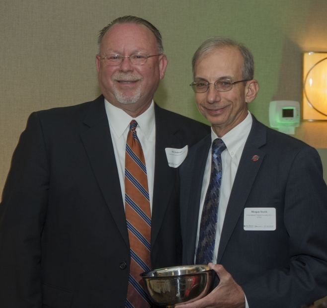 CNS President and CEO Morgan Smith (at right) receives the Oak Ridge Chamber of Commerce’s Kerry Trammell Volunteer of the Year award from Oak Ridge Associated Universities Vice President and CFO Phil Andrews, who served as past chair of the Chamber’s board of directors.