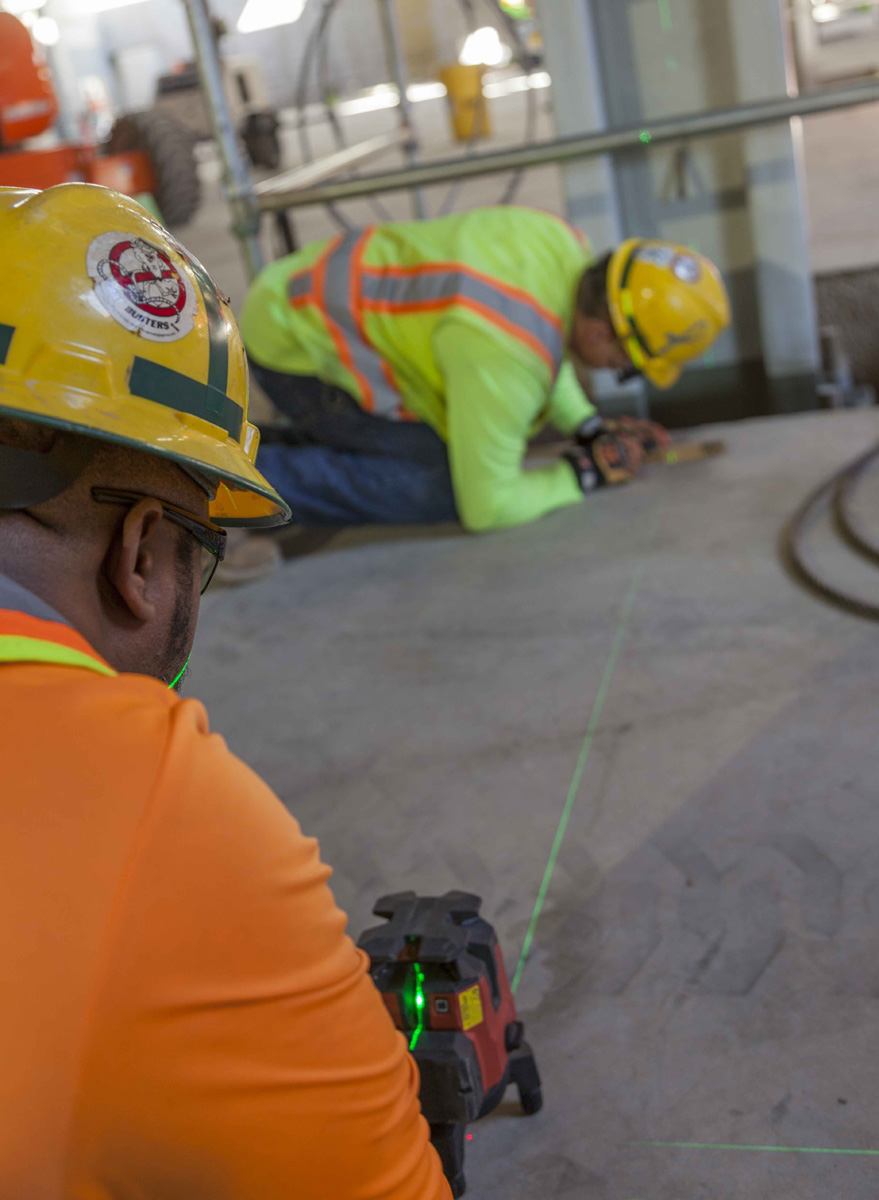 A Uranium Processing Facility (UPF) crew performs layout work in the UPF Salvage and Accountability Building.