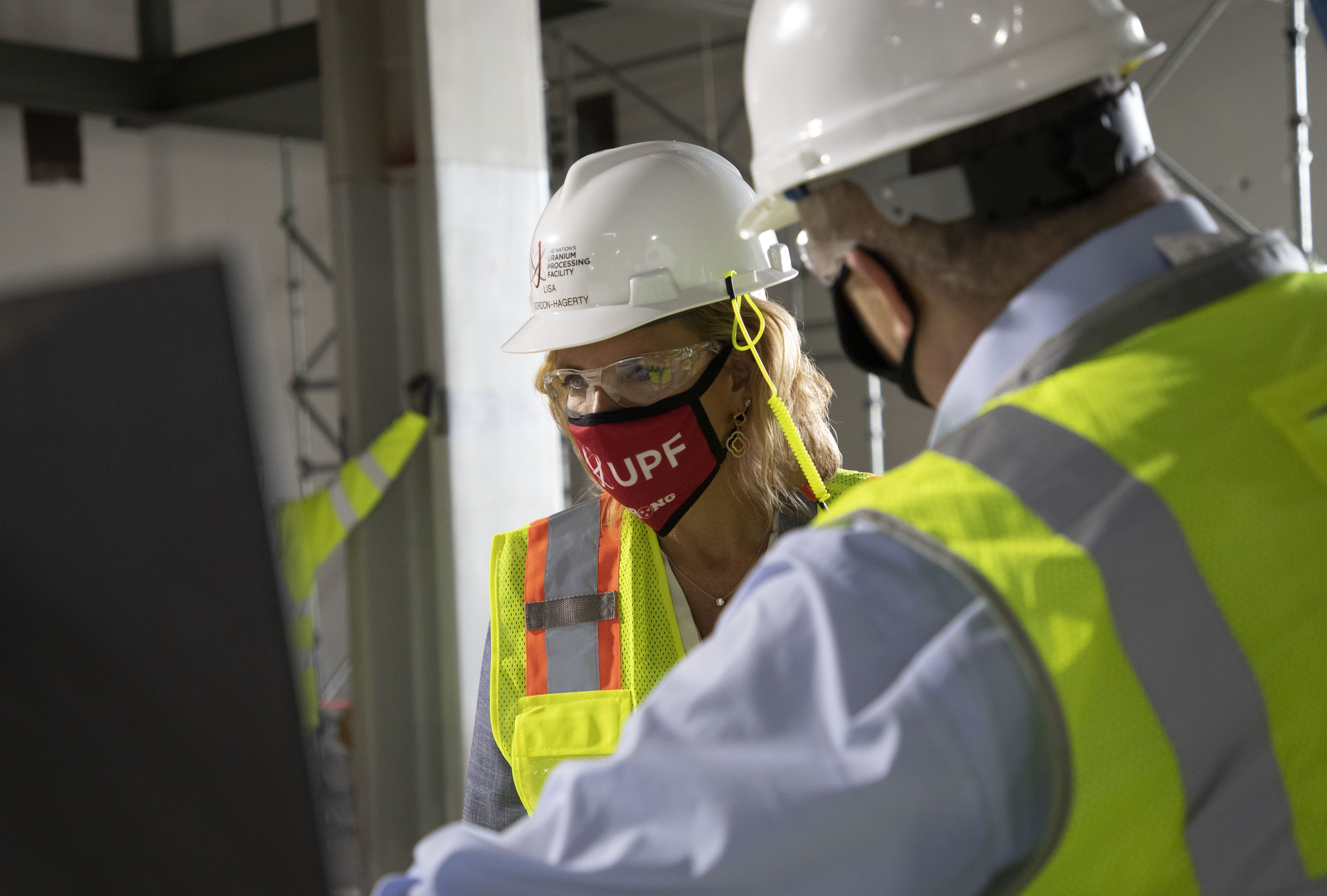 NNSA Administrator Lisa E. Gordon-Hagerty studies a rendering at the UPF Salvage and Accountability Building