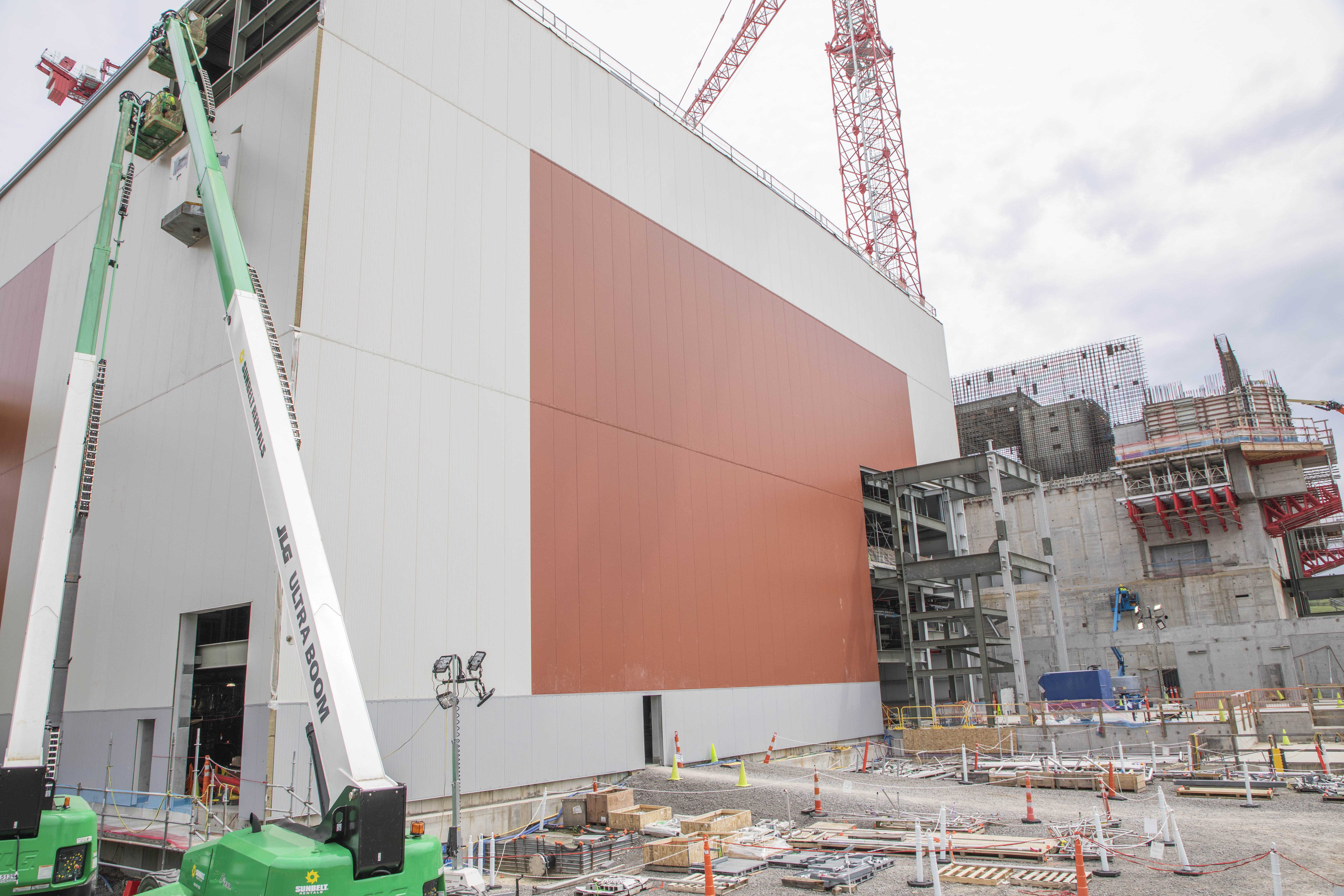 Siding installation work on the Salvage and Accountability Building