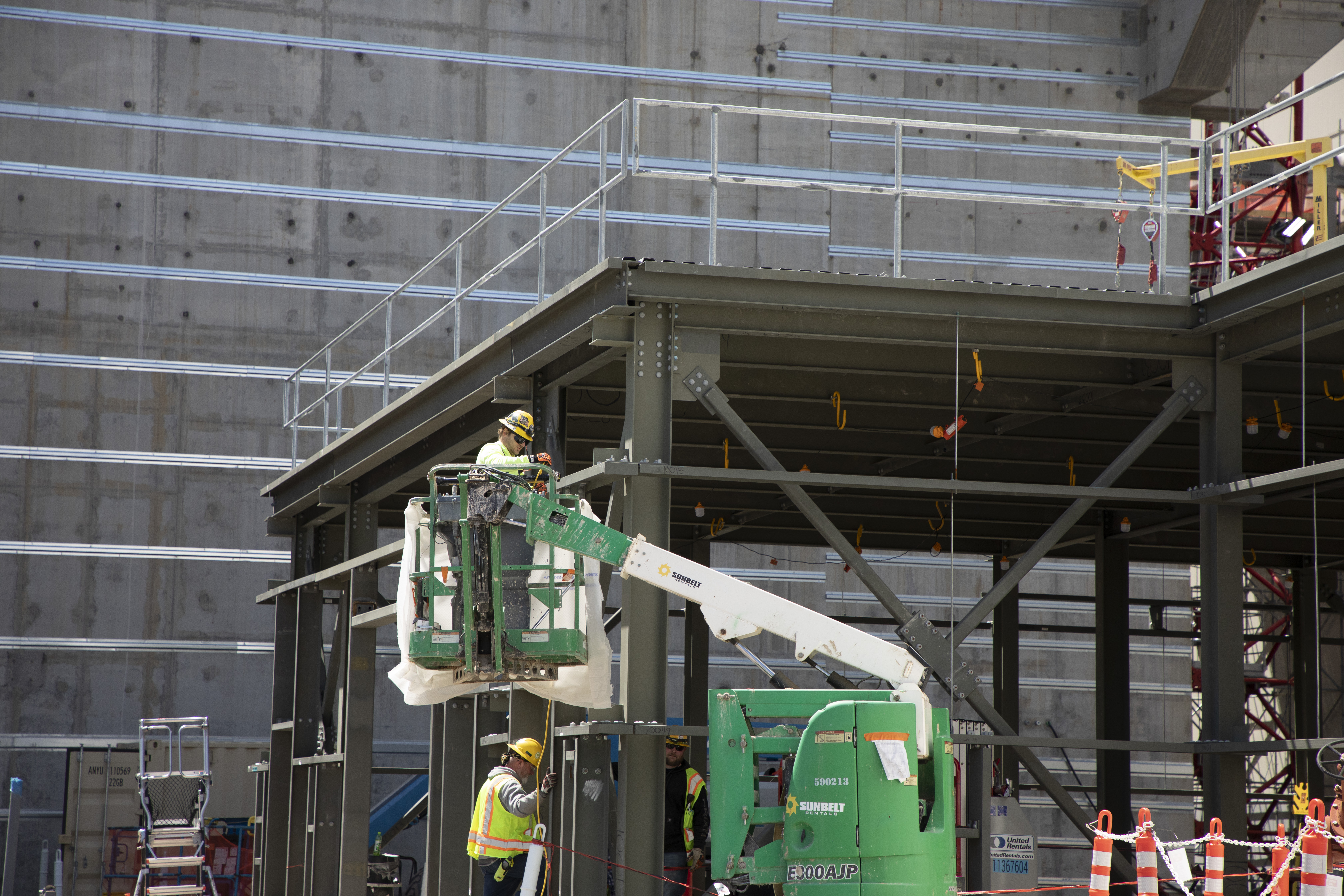 Ironworker snapping structural steel bolts on the Fire Tank Pump House steel girts 