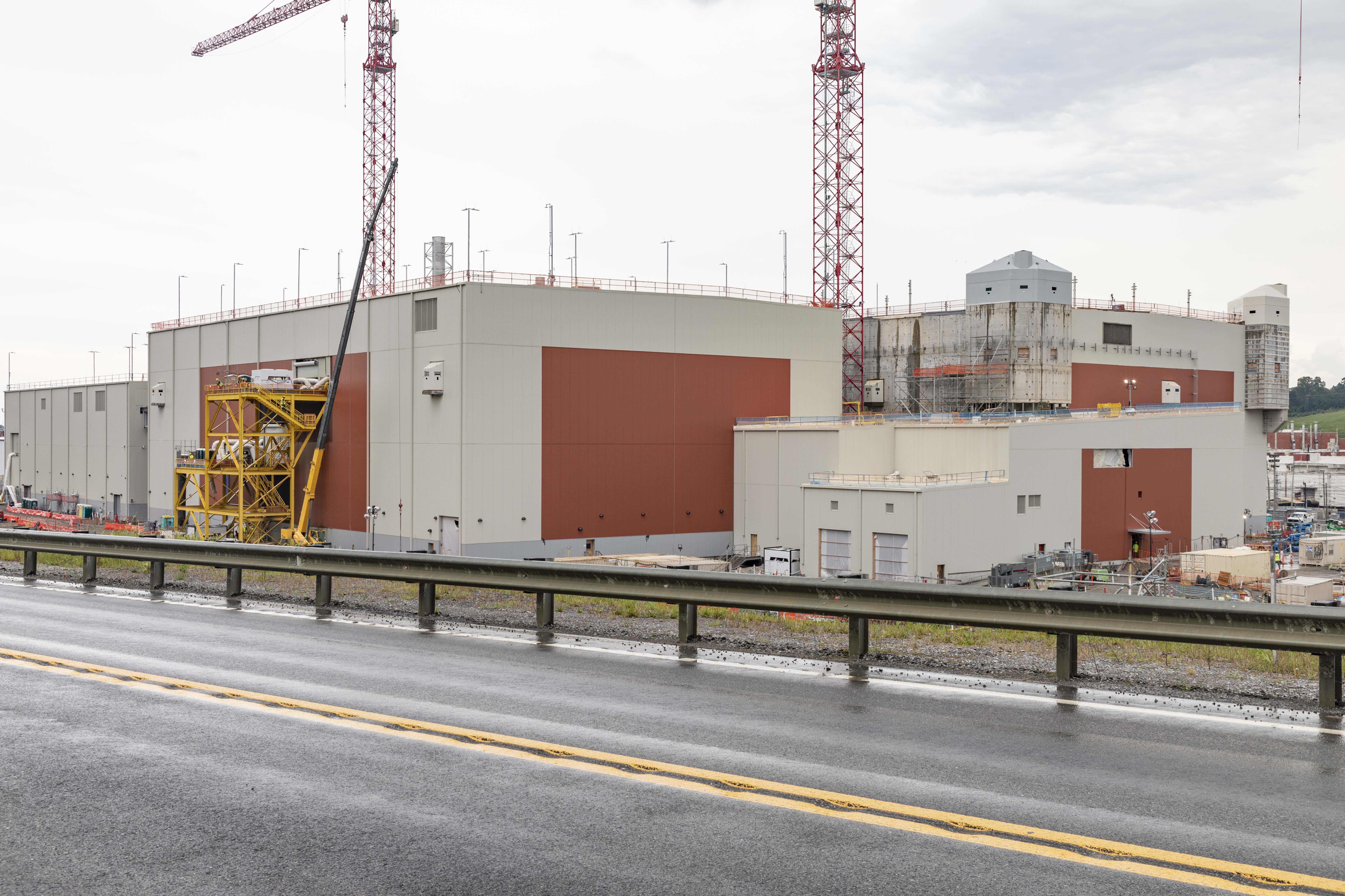 UPF construction site showing Main Process Building siding progress August-2022