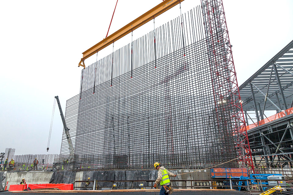 Ironworkers began installing first-level rebar curtain Feb. 4 on the Main Process Building (MPB). The outside rebar layer will be joined by an inside layer for the exterior wall of MPB. Formwork will then be placed outside the curtain and the concrete placed. 