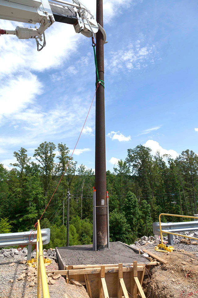 Installation of a communications system pole at the Substation for the Uranium Processing Facility. 