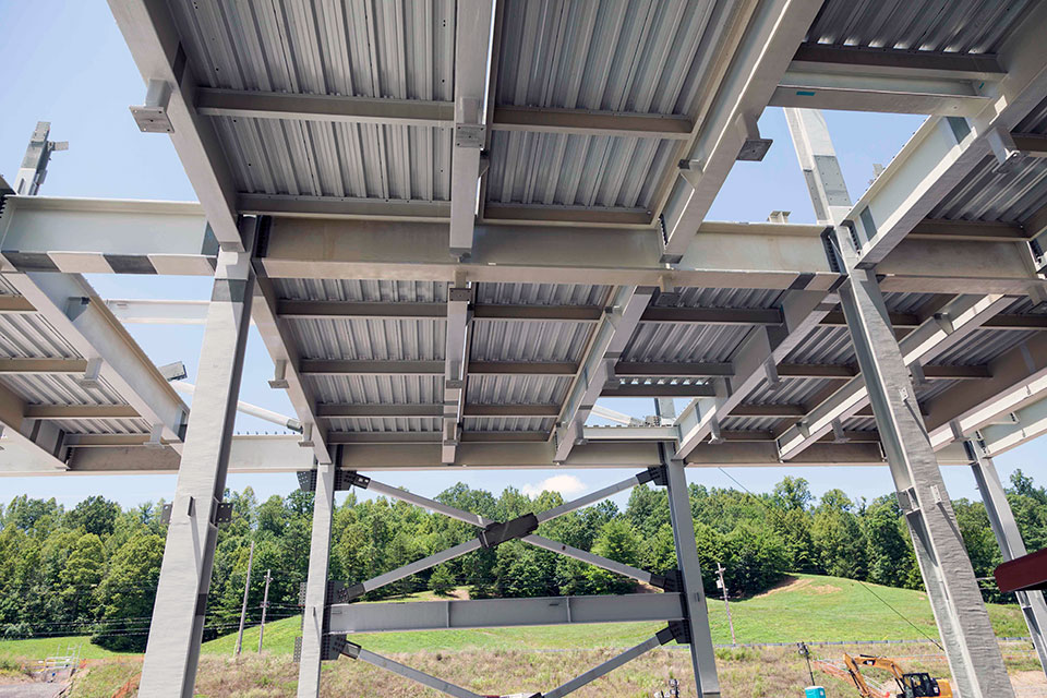 As additional pieces of structural steel are installed at the Salvage and Accountability Building, work on the second floor begins. 