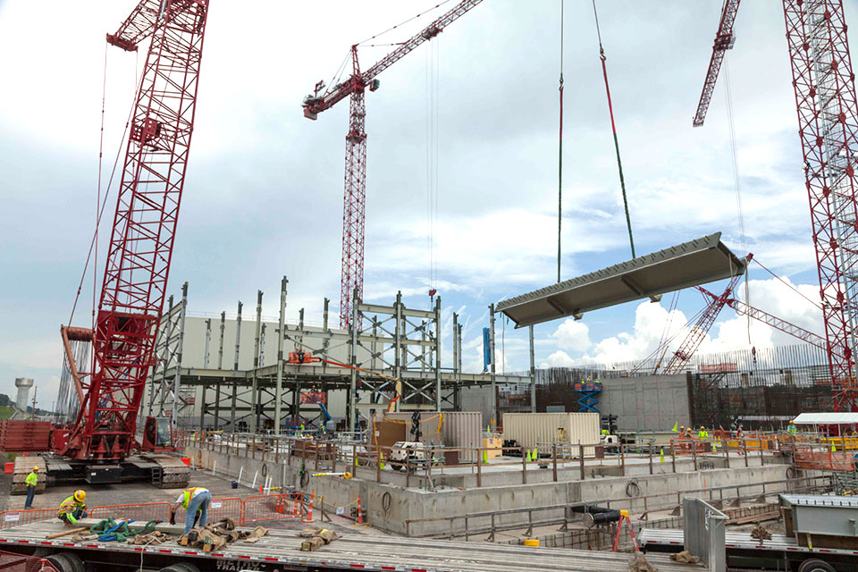 A crane moves a steel beam to be installed at the Uranium Processing Facility Project’s Salvage and Accountability Building. The first phase of structural steel installation will continue over the summer and calls for almost 800 pieces that collectively weigh about 1,500 tons. 