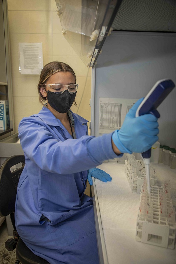 Worker prepares samples for a high resolution-inductively coupled plasma mass spectrometry instrument.