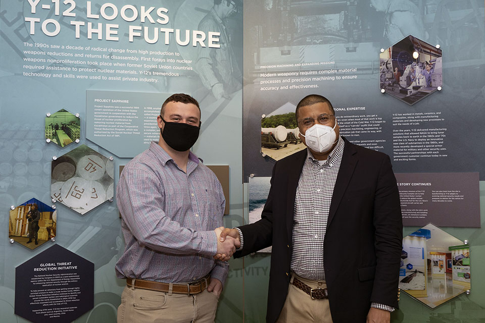 NNSA Principal Deputy Administrator Frank Rose (right) shakes hands with Y‑12 employee and local hero Brody Roberts 