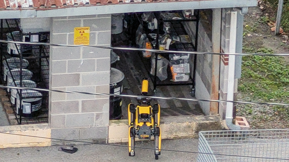  With Y-12’s emergency responders at a safe distance away, Mr. T, one of the site’s two robotic dogs, investigates an unknown chemical spill at Y-12. 