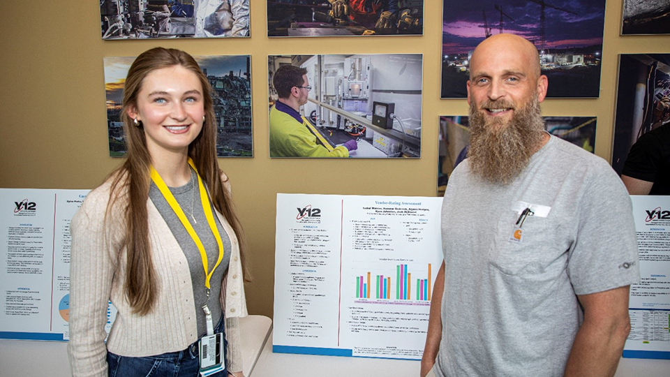 Isabel and Jeremy W. at the 2025 Intern Expo, where Isabel presented on her project that focused on vendor rating assessments. 