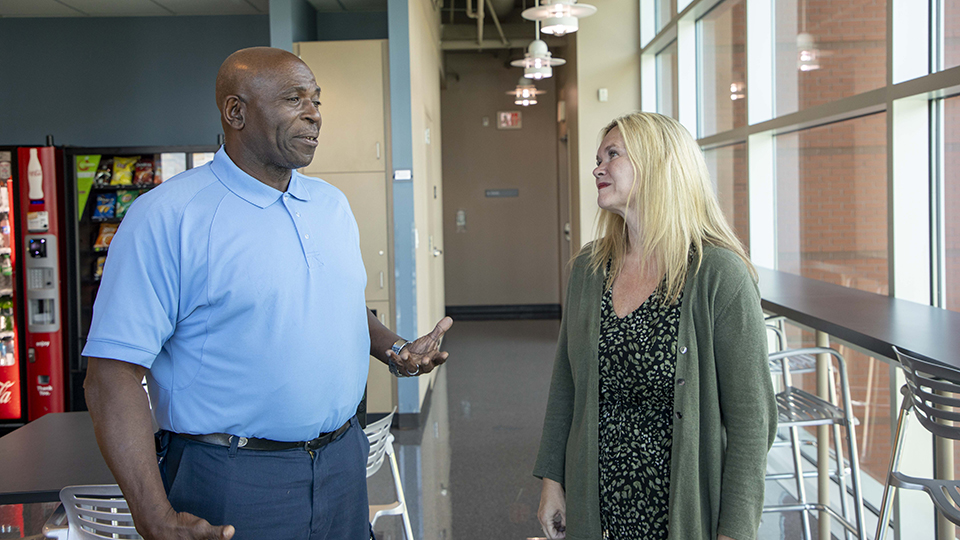 Nate S. of Lawler-Wood Y-12 and Jan West, deputy manager of Production and Operations, take a moment to exchange cost-free kindness. Nate has been working in Oak Ridge for 35 years, and he says he has enjoyed every day of it. 