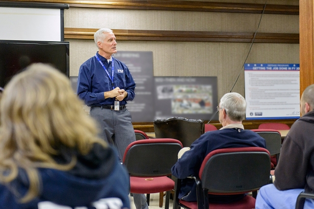 NNSA Uranium Program Manager Tim Driscoll speaks with the One-Metric-Ton Challenge team in Building 9212. The team has undertaken an extensive dedicated maintenance effort to improve metal production equipment reliability and reduce unexpected down time, with an end goal of significantly increasing purified metal production by fiscal year 2017.