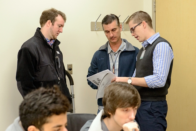 Y-12’s Dan Romano (center) serves as the controller for the blue team.