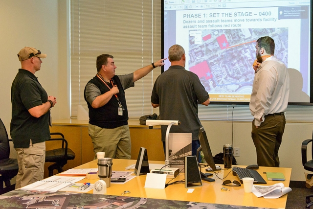 At the end of the day, Y-12’s Greg Verner, Howard Hall, Jeff Knott, and John Gill (UT) summarize the battle board event and the lessons learned.